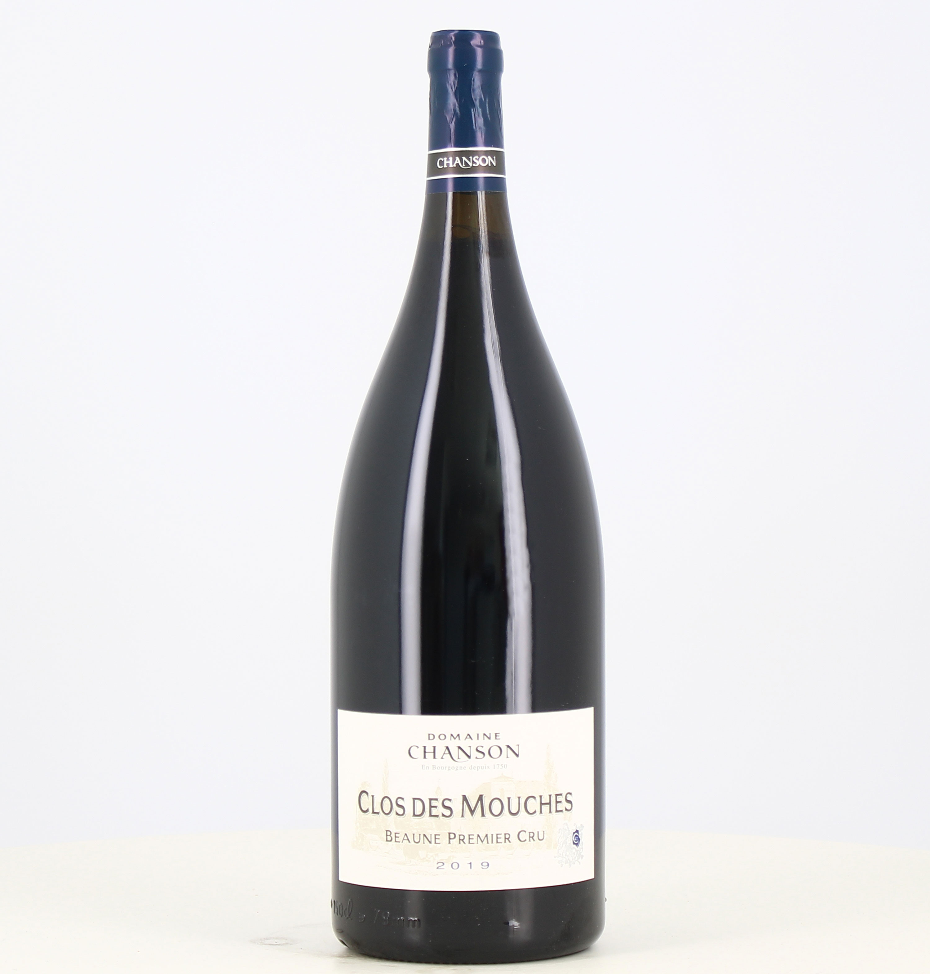 Magnum Rouge Beaune 1er cru Clos des Mouches 2019 Domaine Chanson 

Translated to Spanish:

Magnum Rouge Beaune 1er cru Clos des 